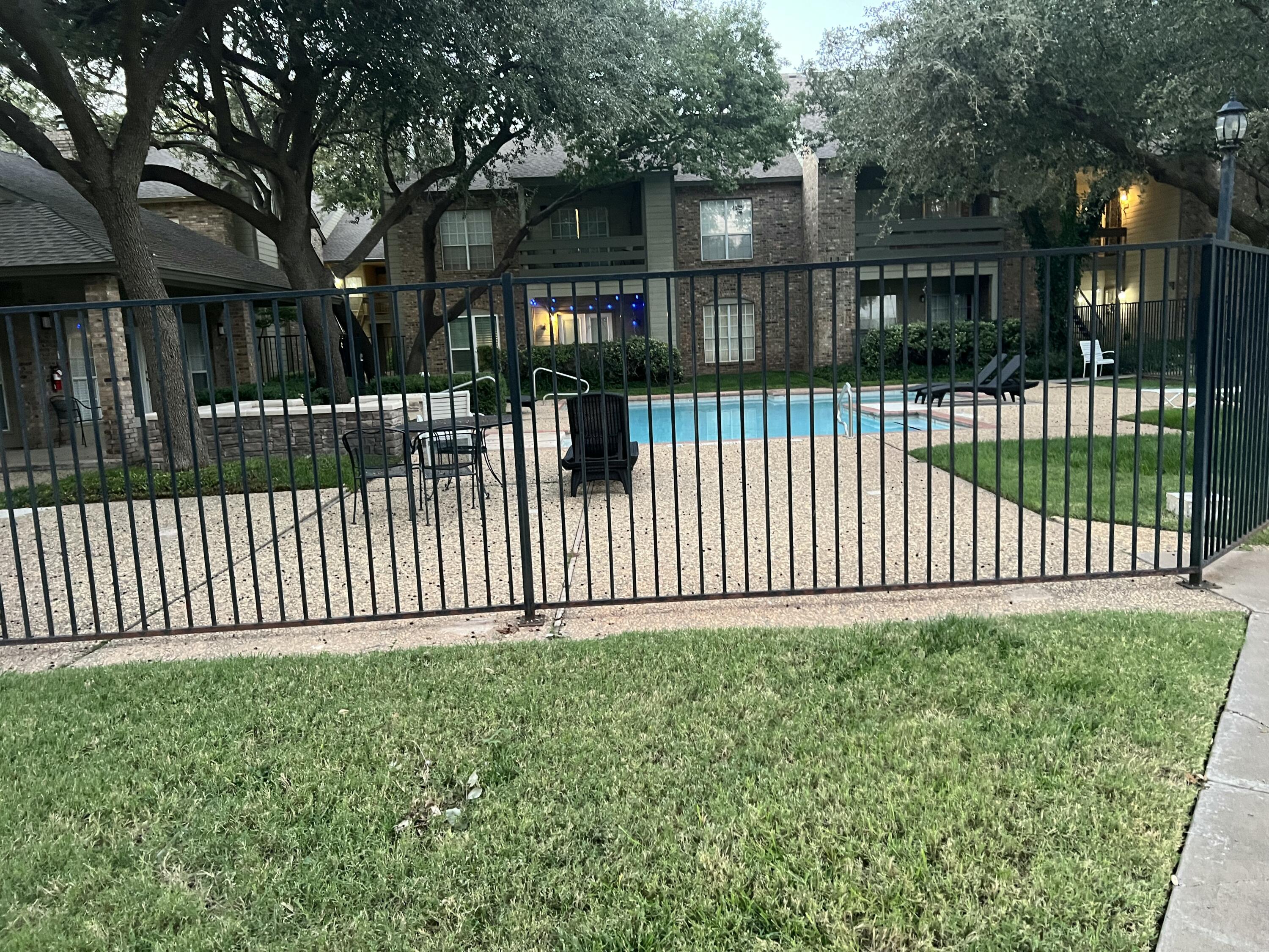 5102 80th Street Lubbock, TX 79424 - Photo 17 of 20 a view of a white house in the back yard