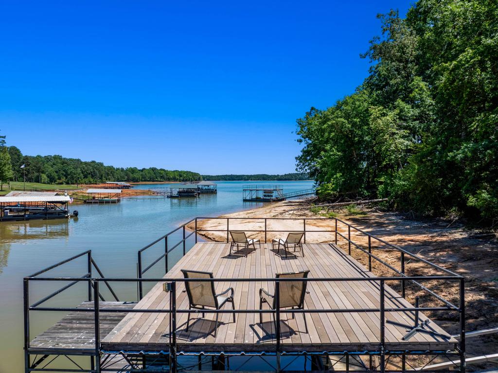 217 Maret Road Townville, SC 29689 - Photo 15 of 35 A private dock with direct water access and sandy shoreline offers tranquil lakefront enjoyment.