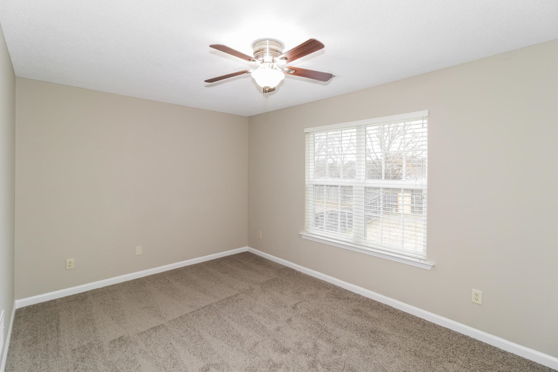 5368 Milton Ridge Drive Arlington, TN 38002 - Photo 12 of 17 Carpeted spare room featuring baseboards and a ceiling fan