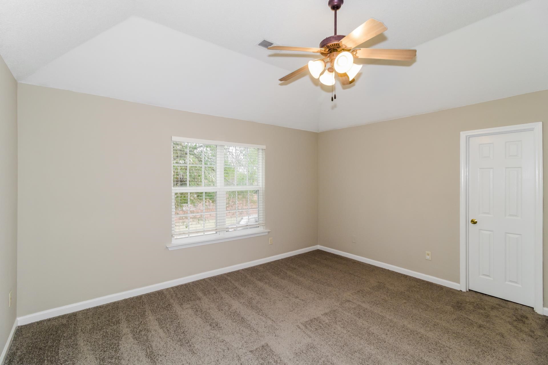 5368 Milton Ridge Drive Arlington, TN 38002 - Photo 9 of 17 Carpeted empty room featuring vaulted ceiling and a ceiling fan