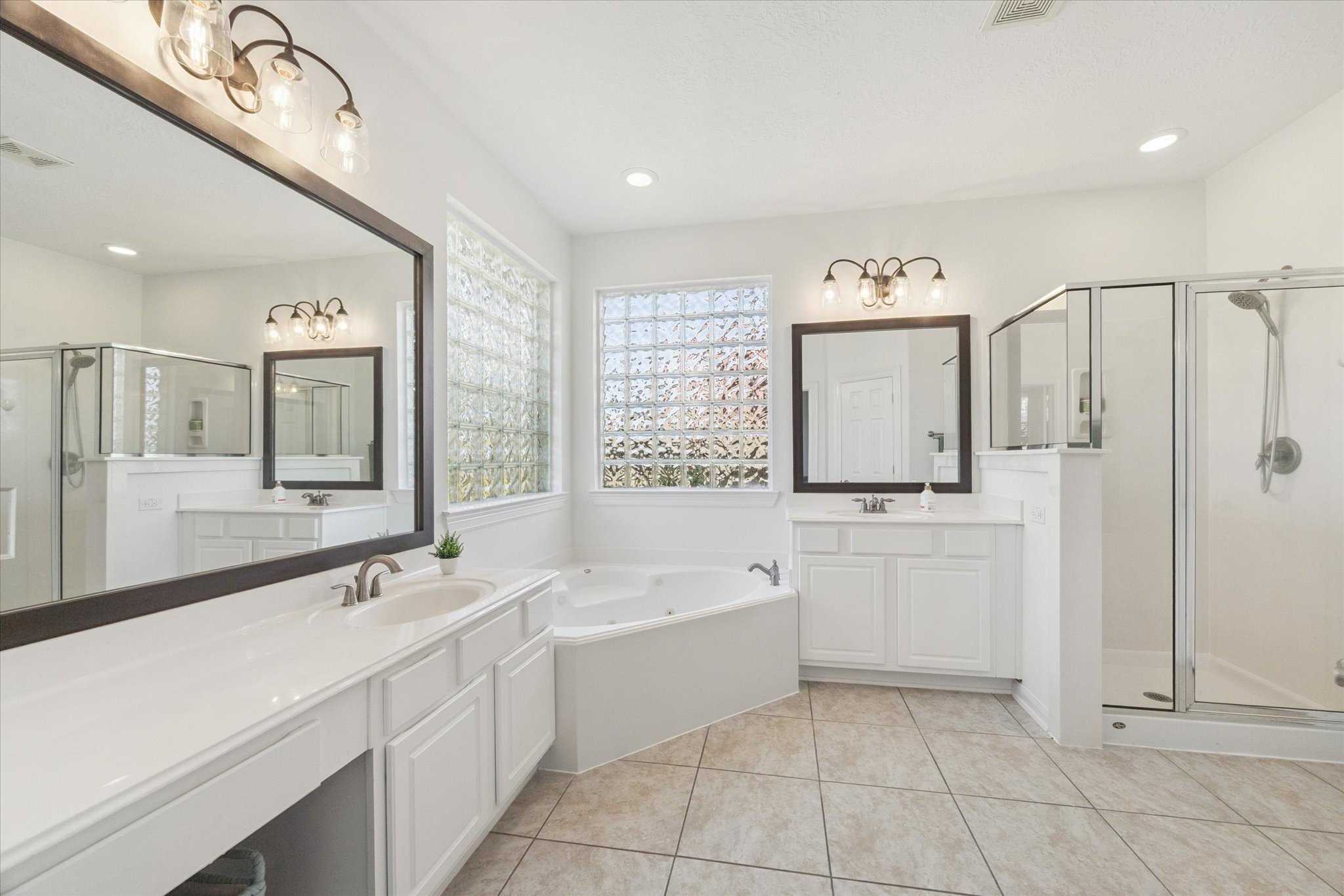 5315 Maverick Point Lane Katy, TX 77494 - Photo 16 of 29 a bathroom with a tub sink and mirror