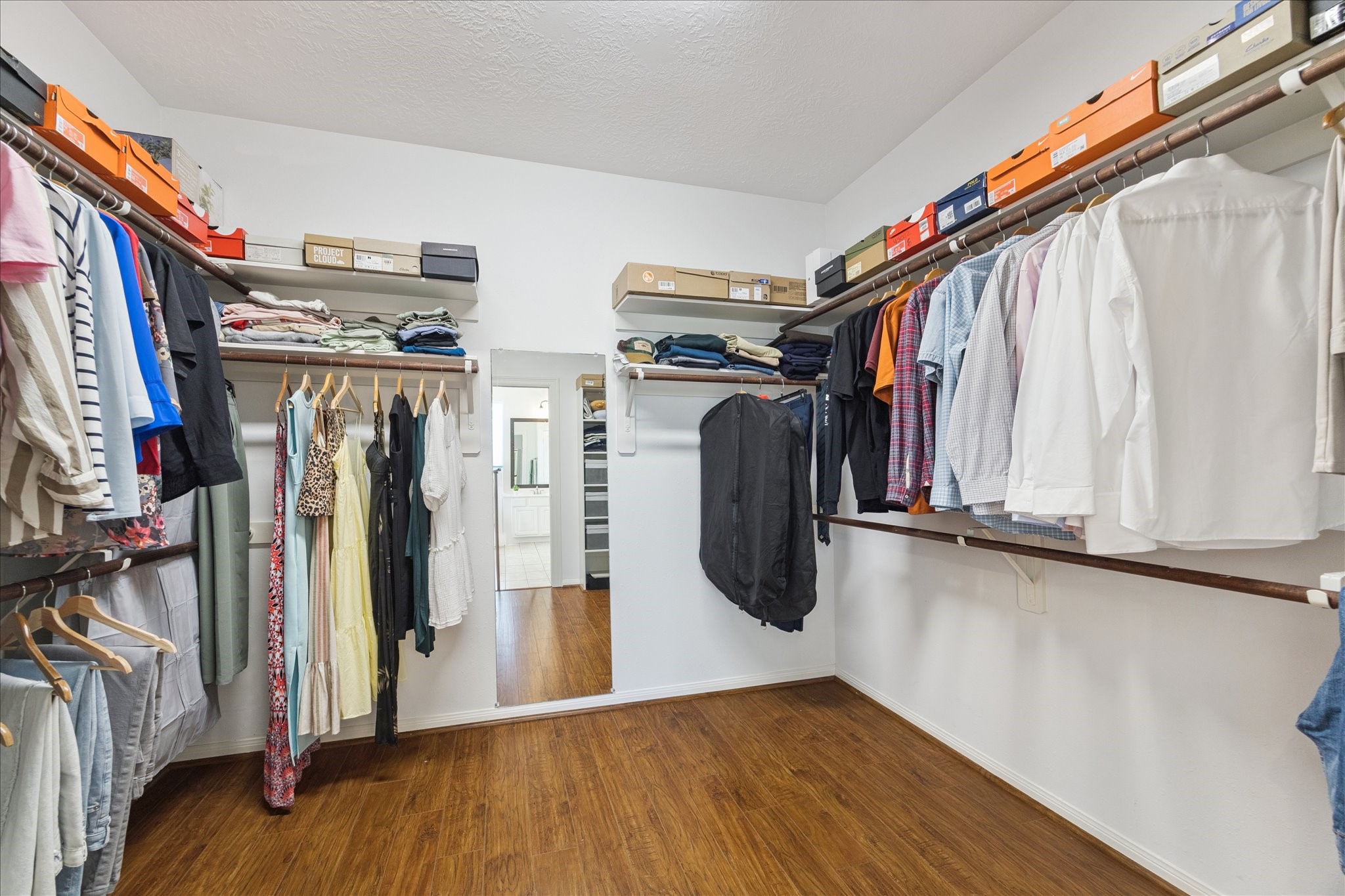 5315 Maverick Point Lane Katy, TX 77494 - Photo 17 of 29 a view of walk in closet with clothes and shoes