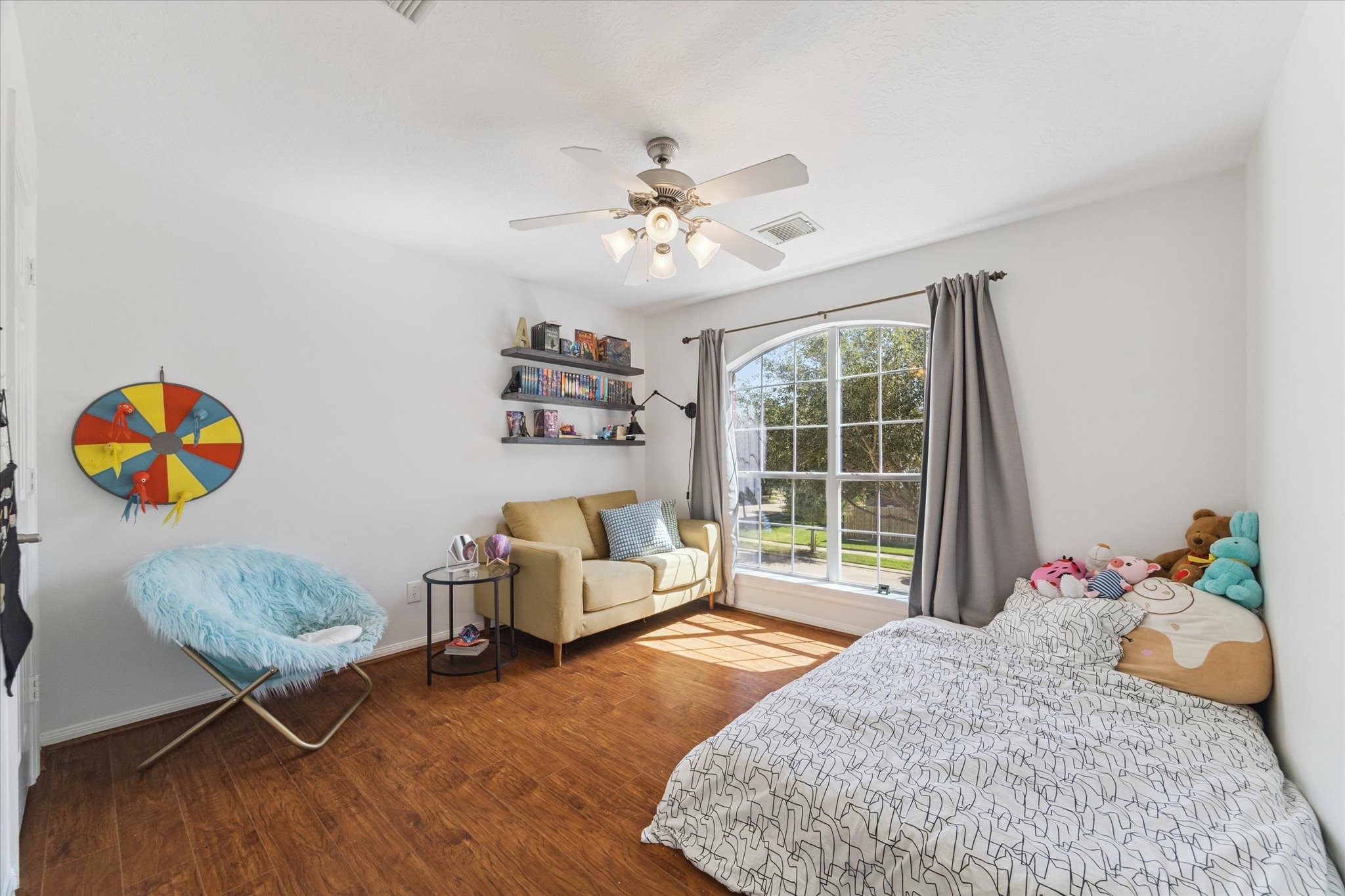 5315 Maverick Point Lane Katy, TX 77494 - Photo 22 of 29 a bedroom with a bed and a couch