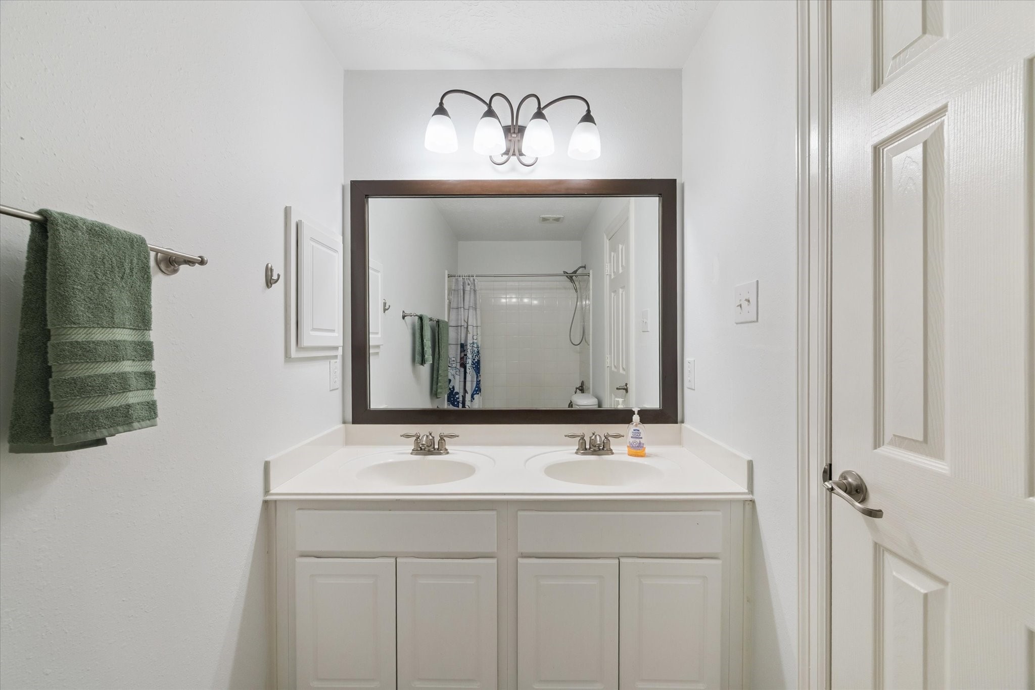 5315 Maverick Point Lane Katy, TX 77494 - Photo 26 of 29 a bathroom with a sink and a mirror
