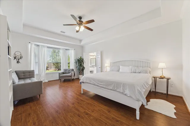 a bedroom with a bed and a couch