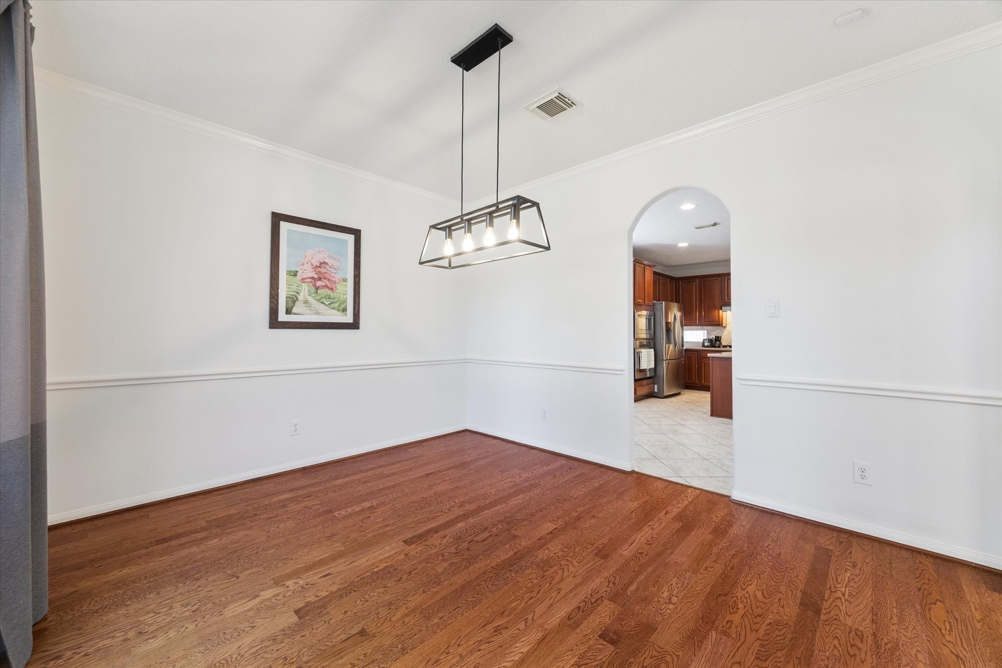 5315 Maverick Point Lane Katy, TX 77494 - Photo 8 of 29 a view of a room with wooden floor and ceiling fan