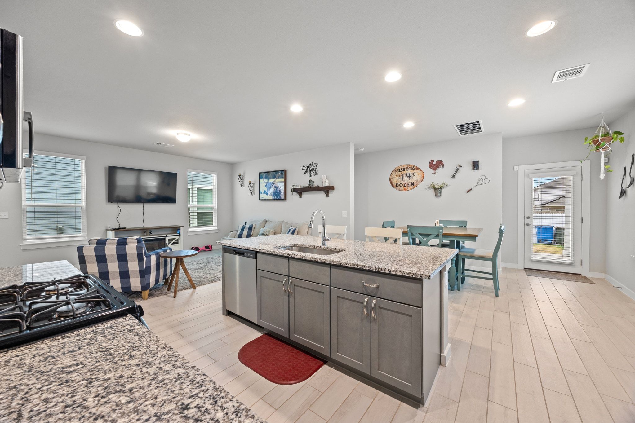 161 Appleberry Lane Elgin, TX 78621 - Photo 17 of 40 a kitchen with a sink stove and cabinets