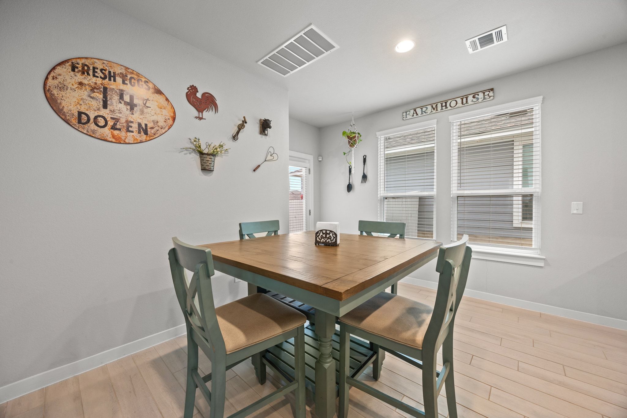 161 Appleberry Lane Elgin, TX 78621 - Photo 18 of 40 a view of a dining room with a table and chairs