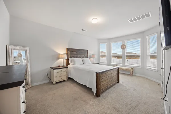 a bed room with a bed and window