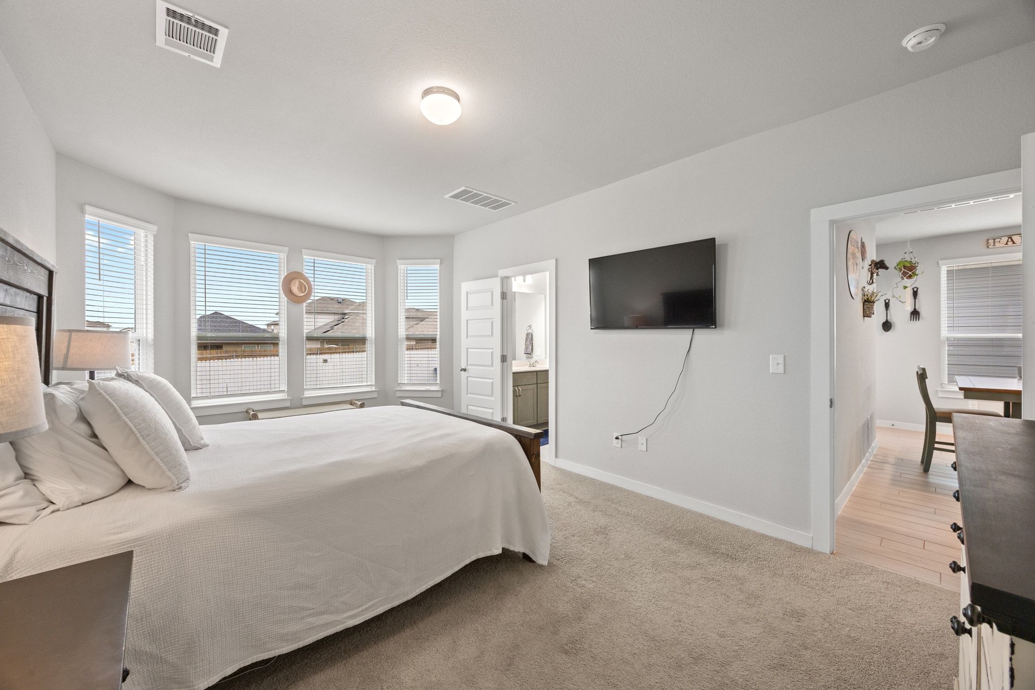 161 Appleberry Lane Elgin, TX 78621 - Photo 20 of 40 a bedroom with a bed and a flat screen tv