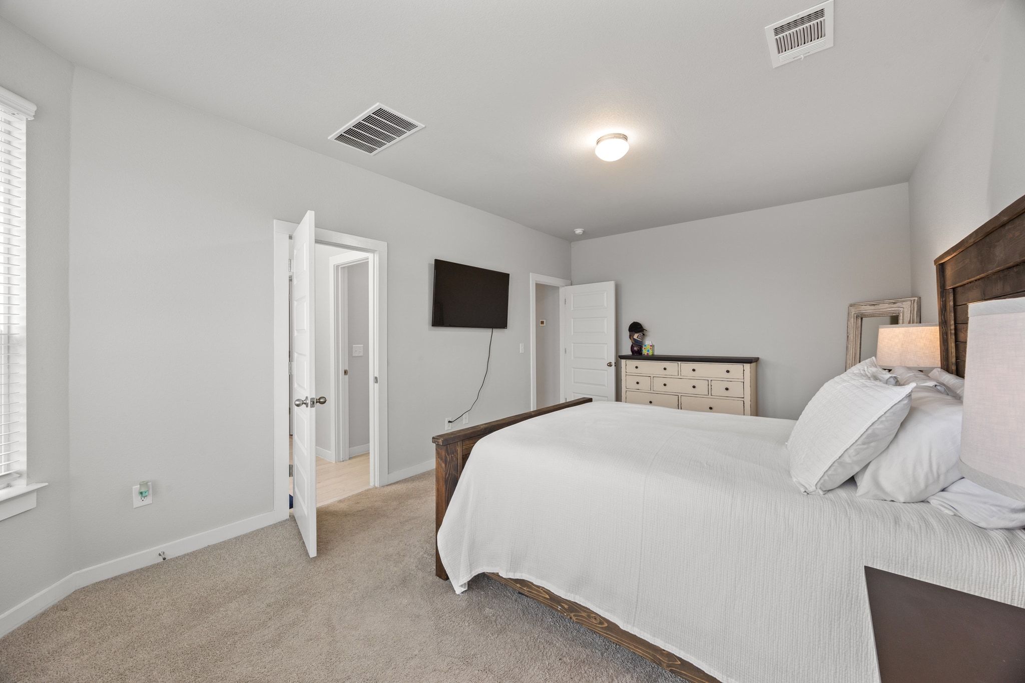 161 Appleberry Lane Elgin, TX 78621 - Photo 21 of 40 a bedroom with a bed and a tv