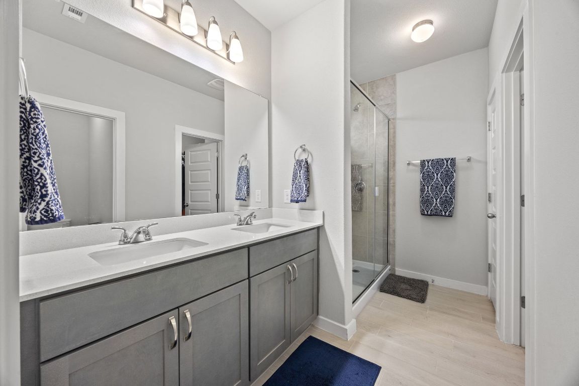 161 Appleberry Lane Elgin, TX 78621 - Photo 22 of 40 Primary bathroom - dual vanity, upgraded shower.