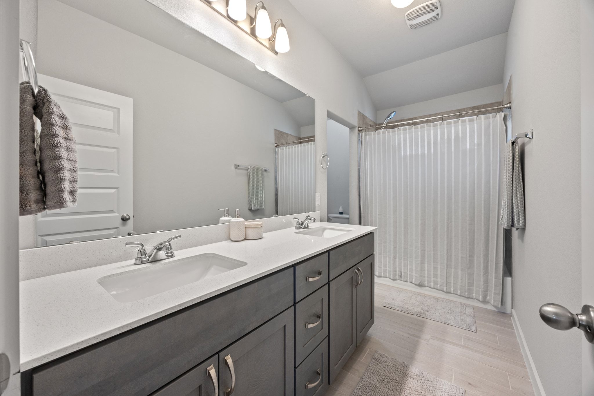 161 Appleberry Lane Elgin, TX 78621 - Photo 28 of 40 a bathroom with a double vanity sink mirror and double