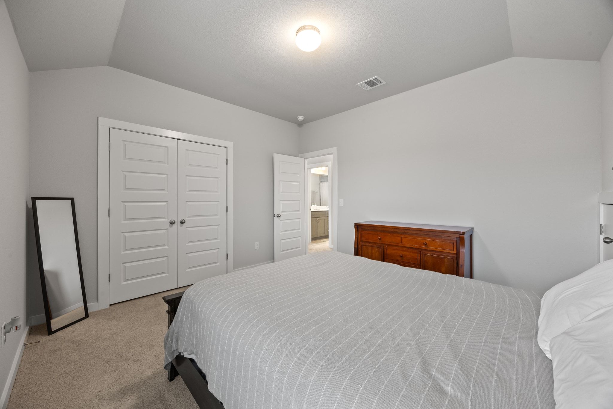 161 Appleberry Lane Elgin, TX 78621 - Photo 32 of 40 a bedroom with a bed and cabinets