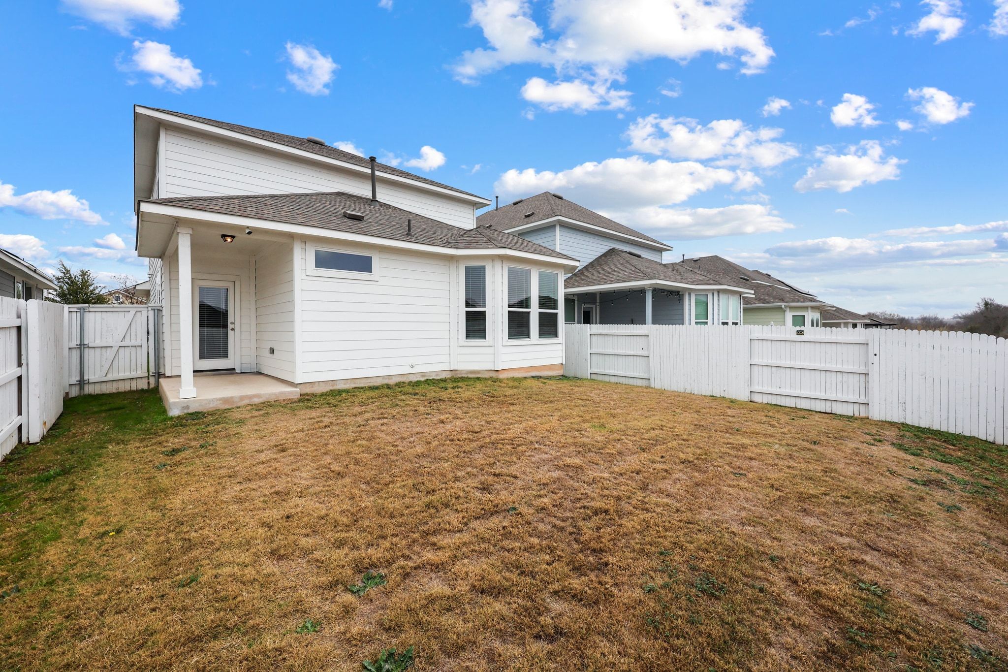 161 Appleberry Lane Elgin, TX 78621 - Photo 33 of 40 a house with trees in the background