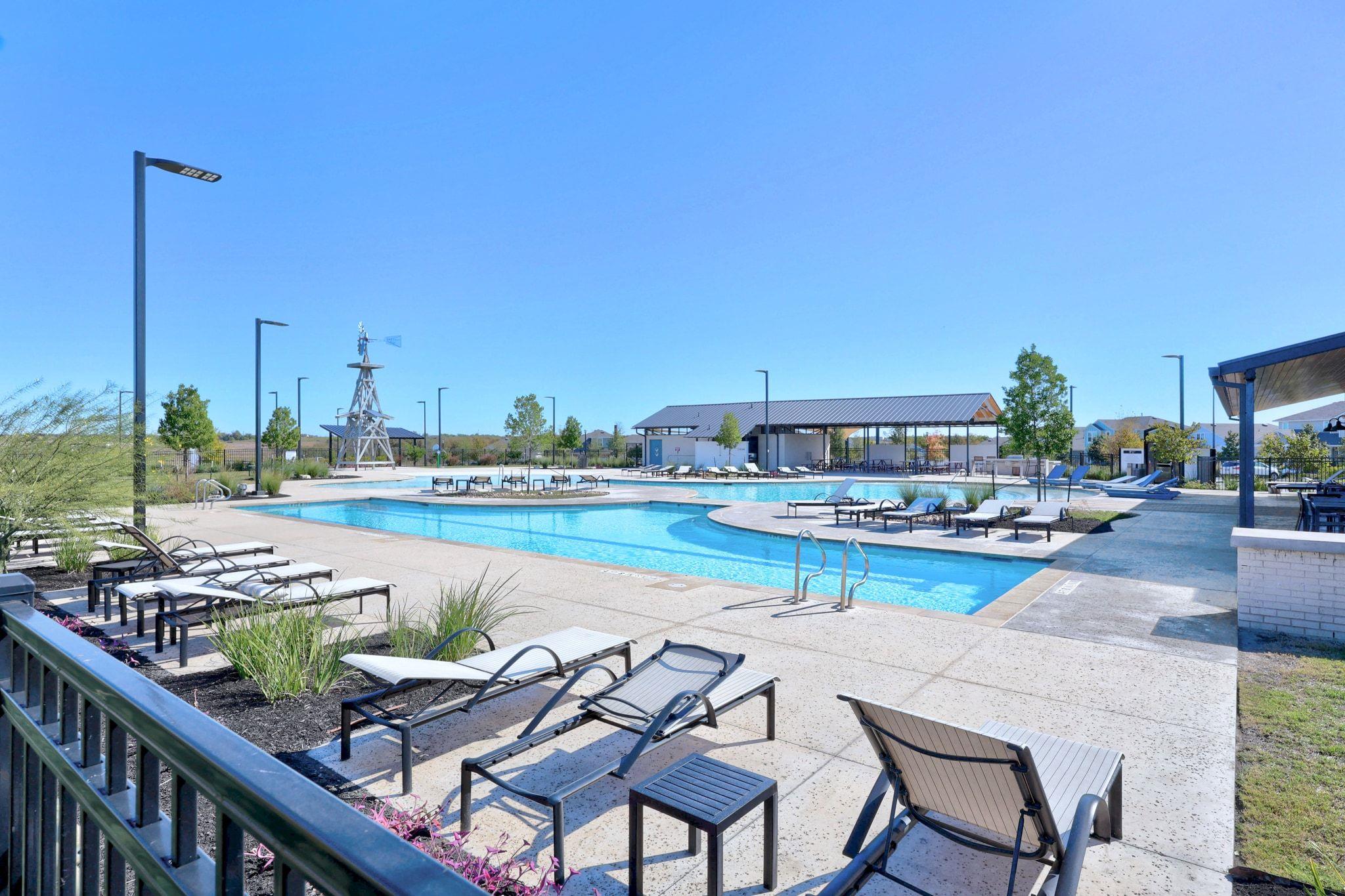 161 Appleberry Lane Elgin, TX 78621 - Photo 39 of 40 a view of swimming pool outdoor seating and city view