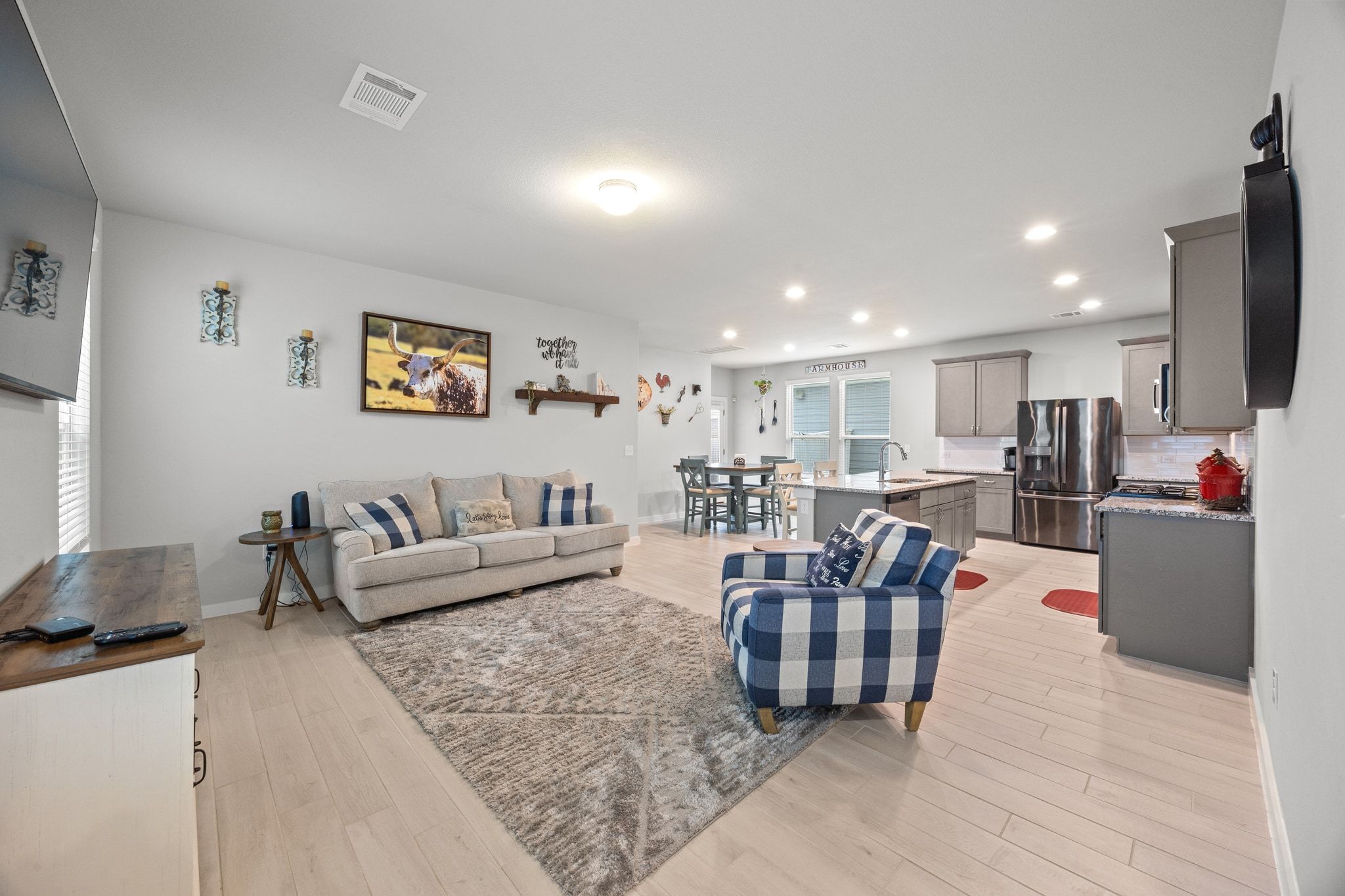 161 Appleberry Lane Elgin, TX 78621 - Photo 8 of 40 a living room with furniture kitchen view and a couch