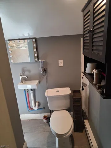 a bathroom with a toilet and a sink