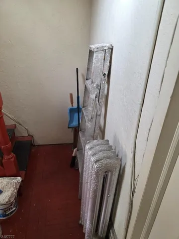 a view of walk in closet with clothes