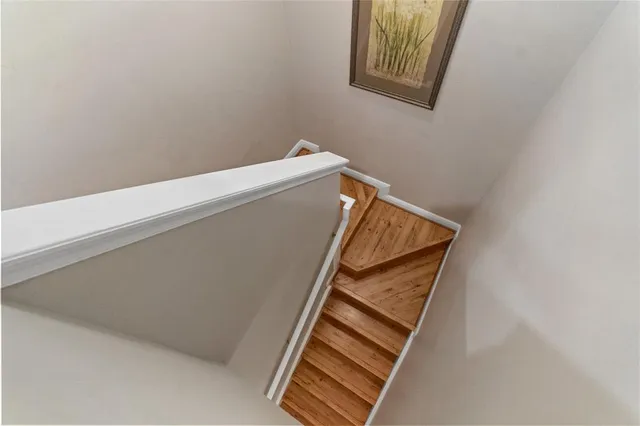 a view of staircase with white walls