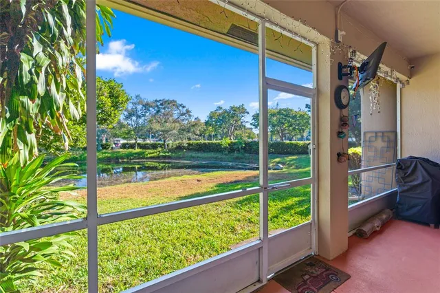 a view of a porch and garden