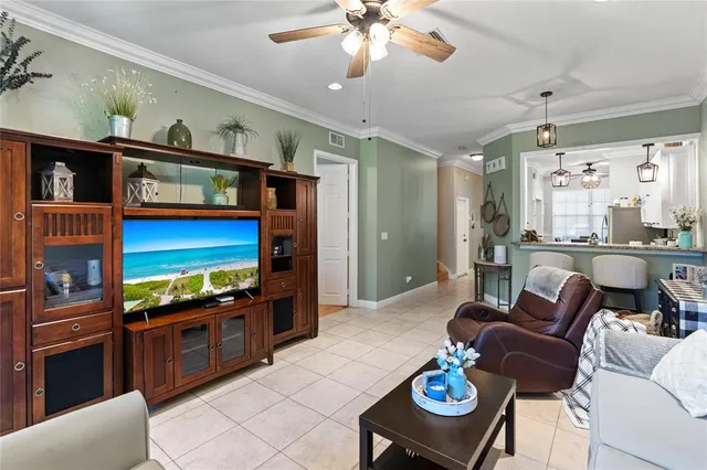 a living room with furniture a rug and a flat screen tv