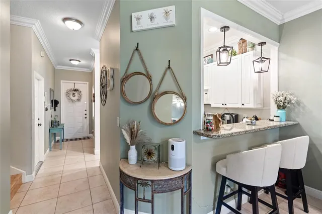a kitchen with a table and chairs in it