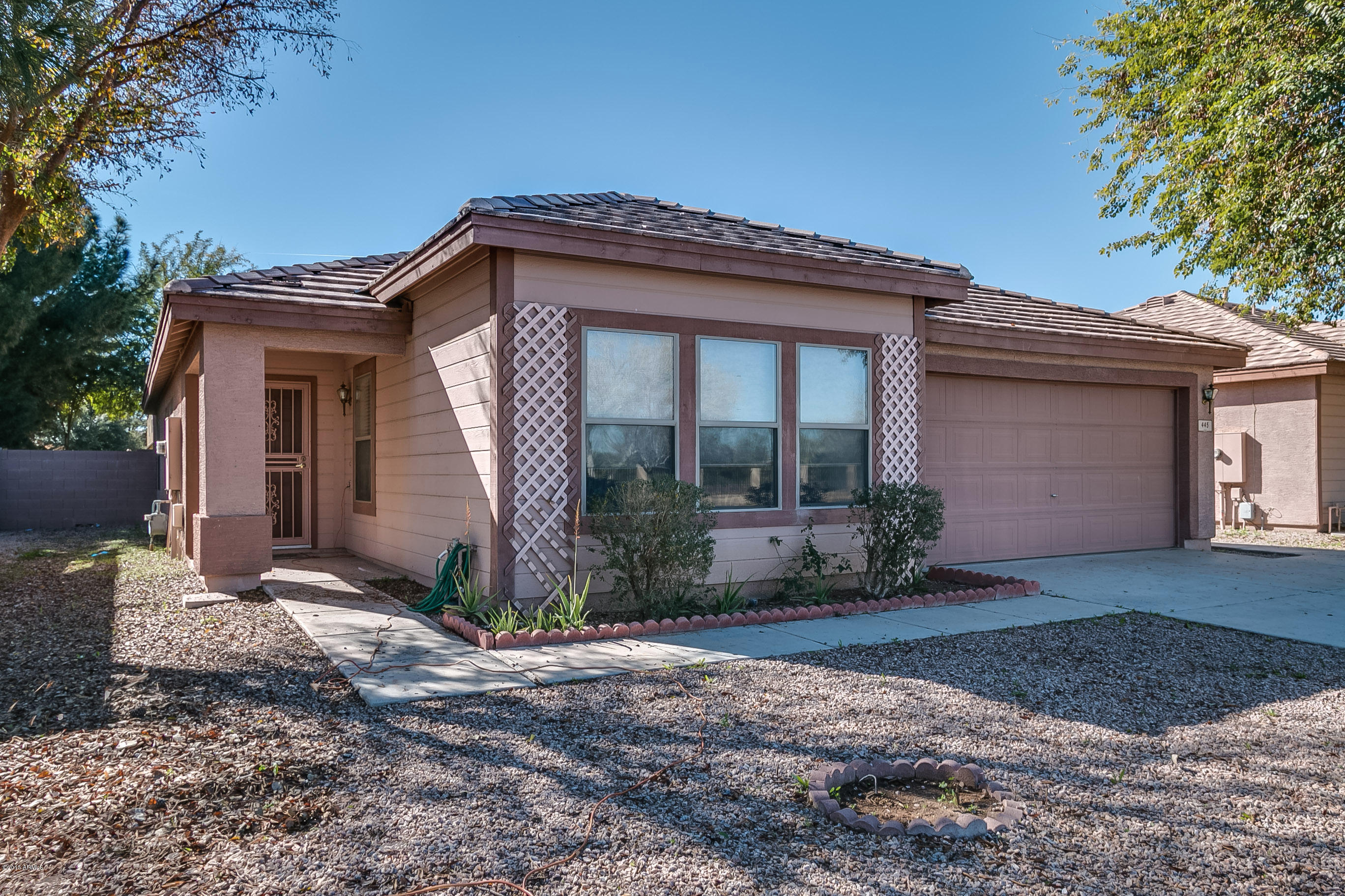 445 West Aviary Way Gilbert, AZ 85233 - Photo 1 of 27 a front view of a house with garden