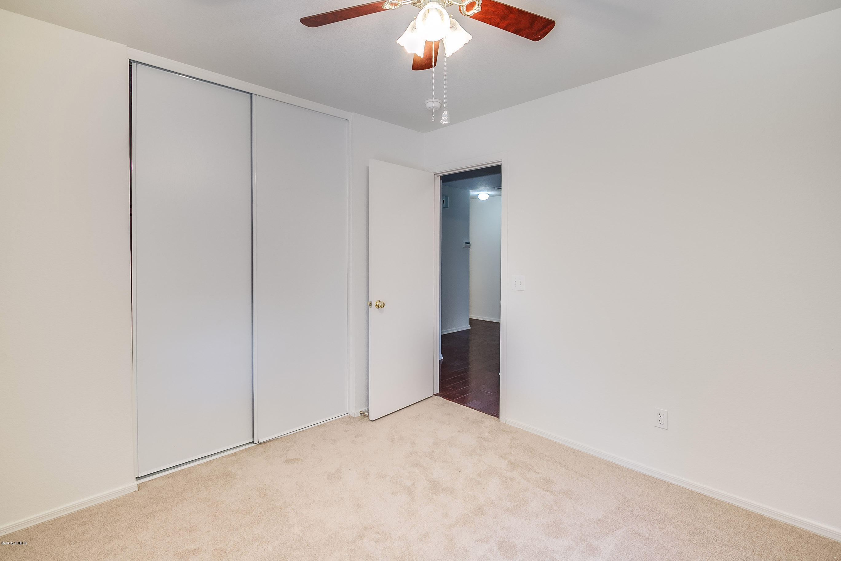 445 West Aviary Way Gilbert, AZ 85233 - Photo 12 of 27 a view of an empty room with a chandelier fan