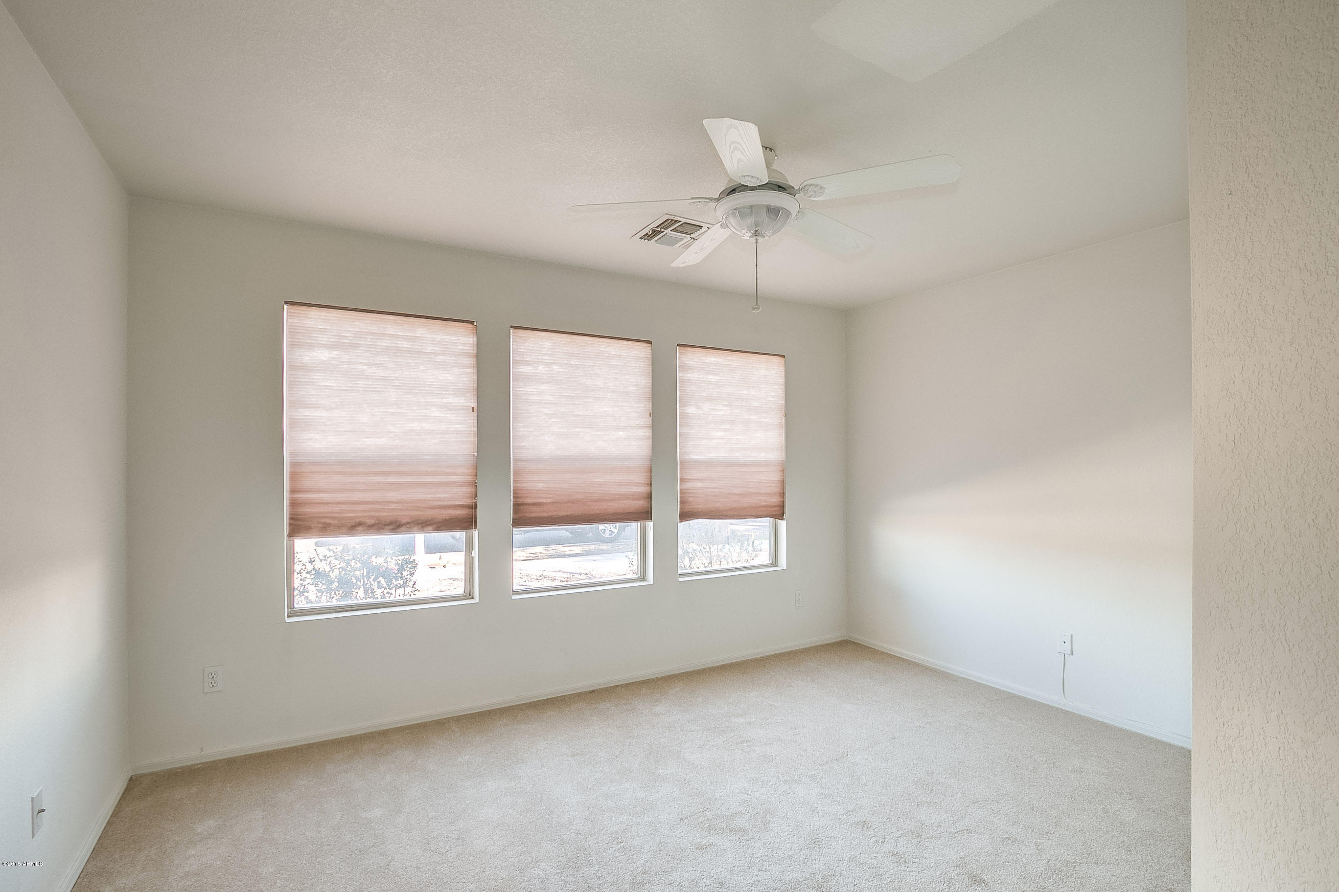 445 West Aviary Way Gilbert, AZ 85233 - Photo 13 of 27 an empty room with a window and ceiling fan