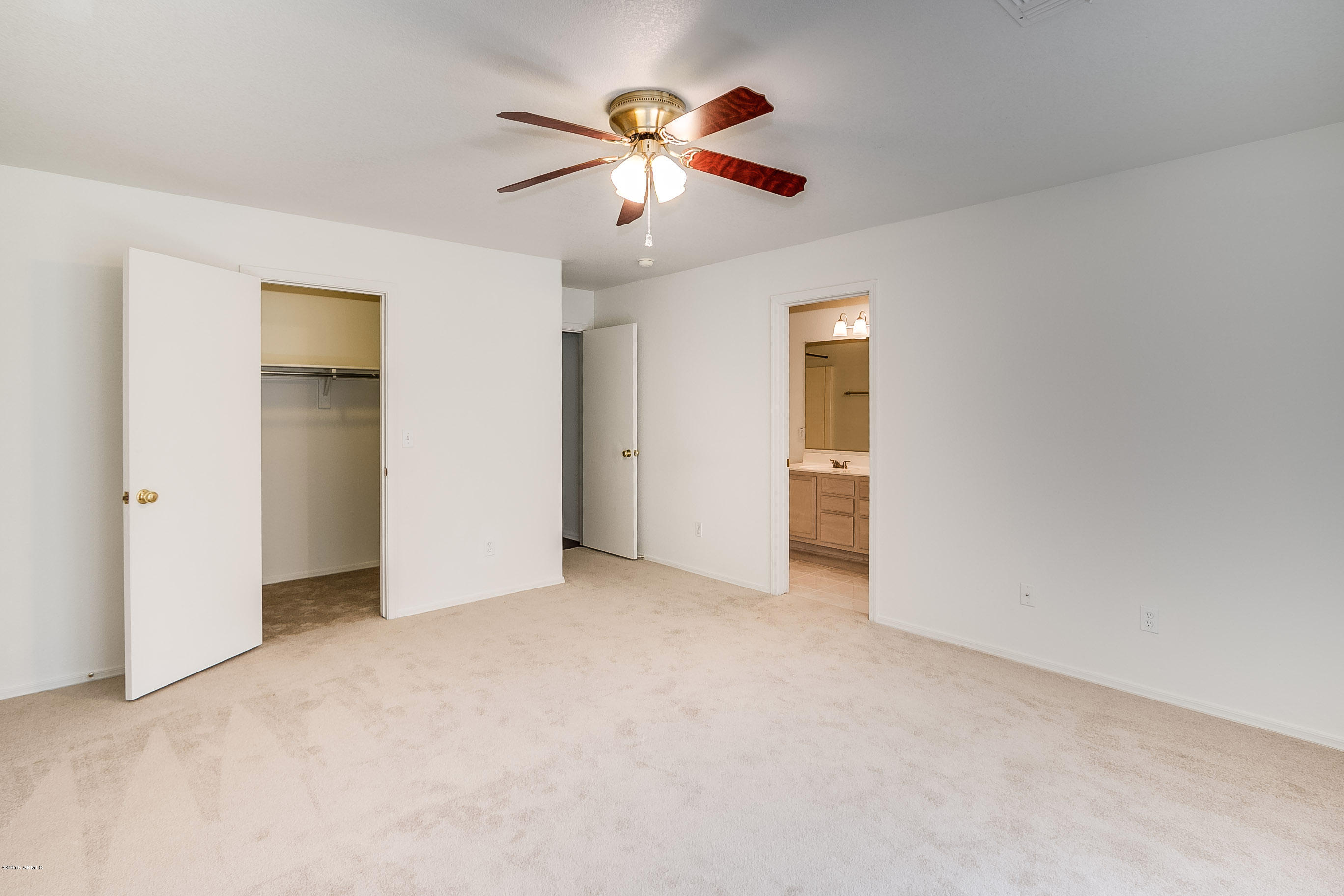 445 West Aviary Way Gilbert, AZ 85233 - Photo 19 of 27 an empty room with closet and fan