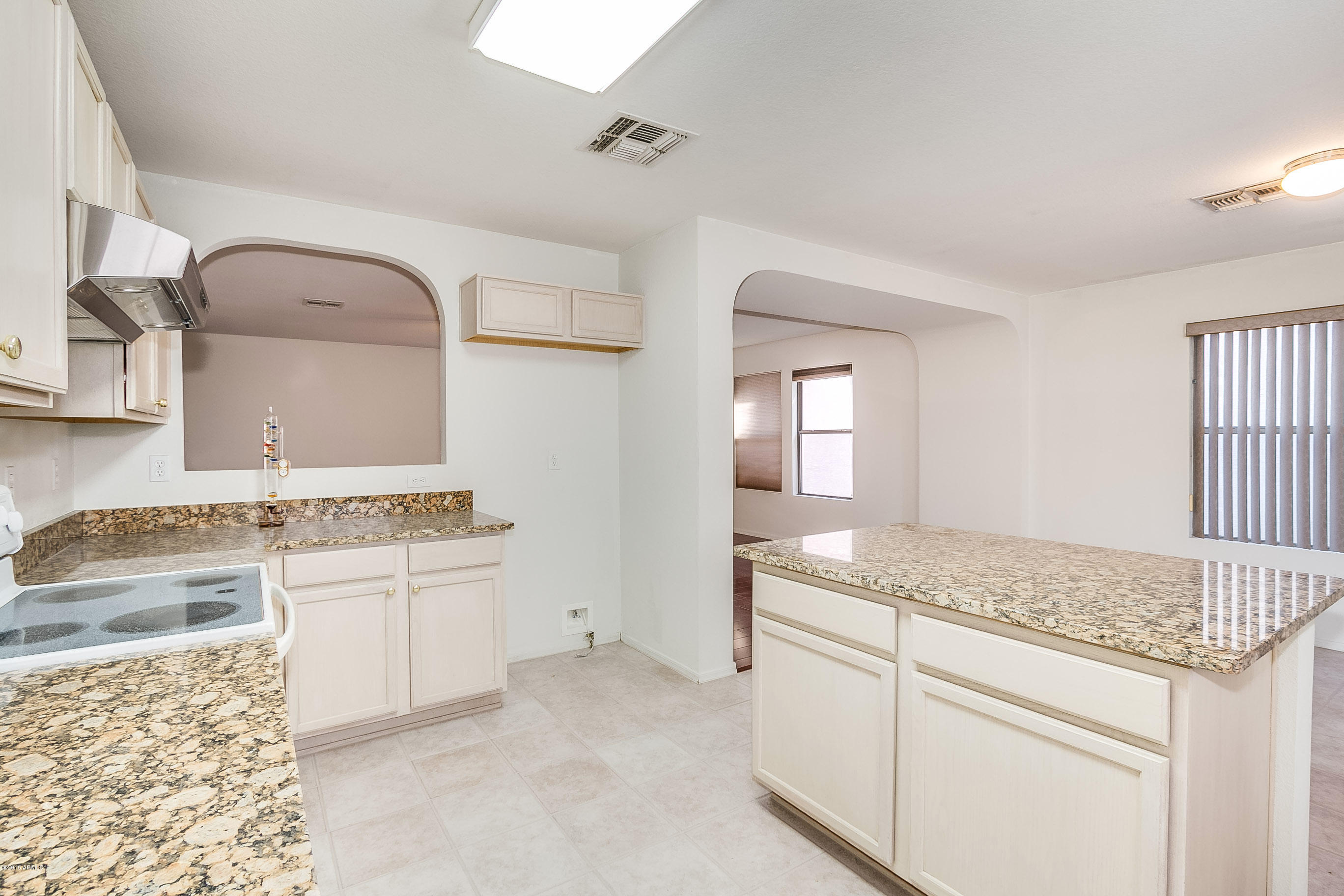 445 West Aviary Way Gilbert, AZ 85233 - Photo 9 of 27 a bathroom with a granite countertop sink and mirror