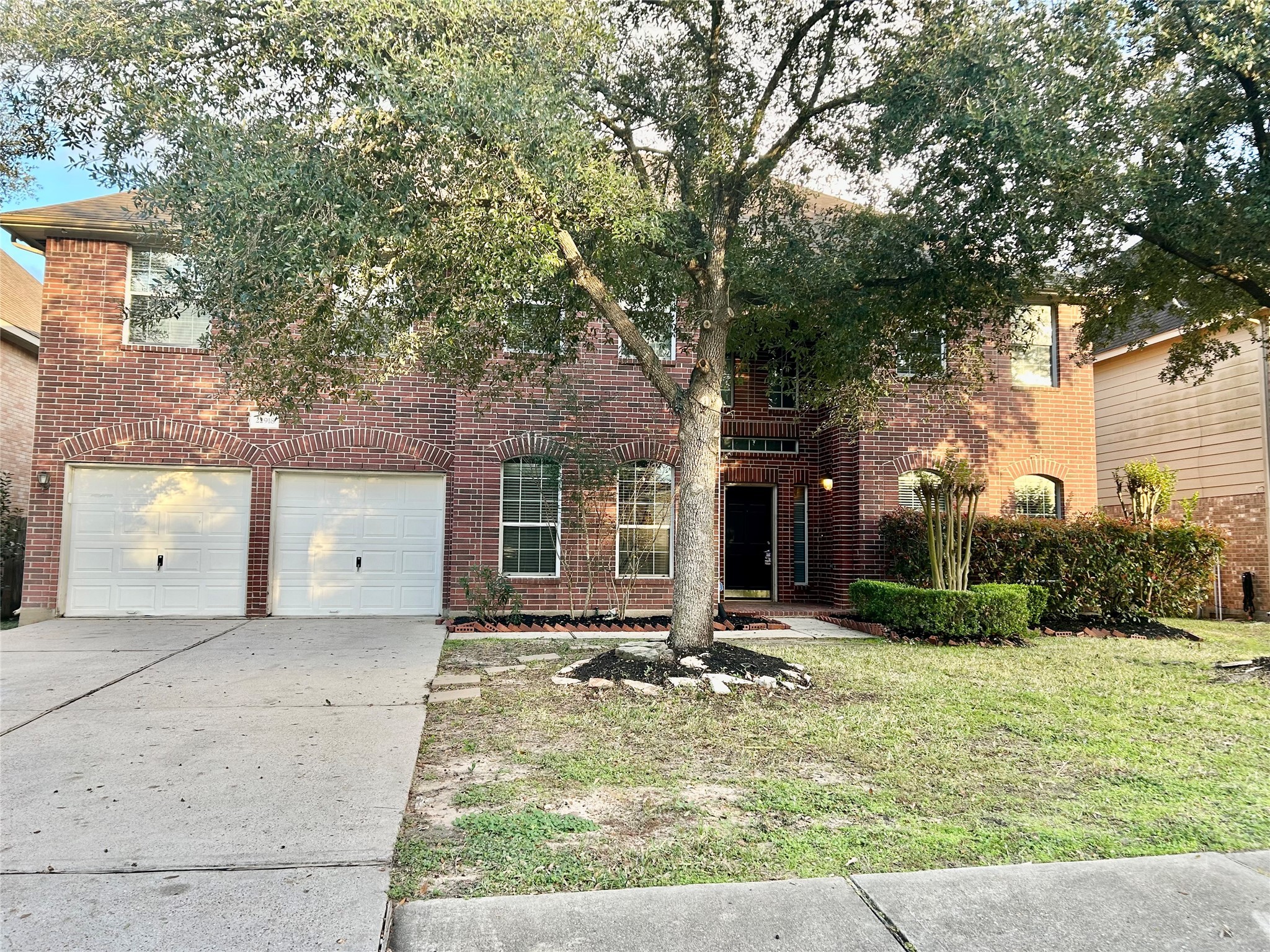 22918 Breton Point Drive Spring, TX 77373 - Photo 2 of 49 a front view of a house with garden