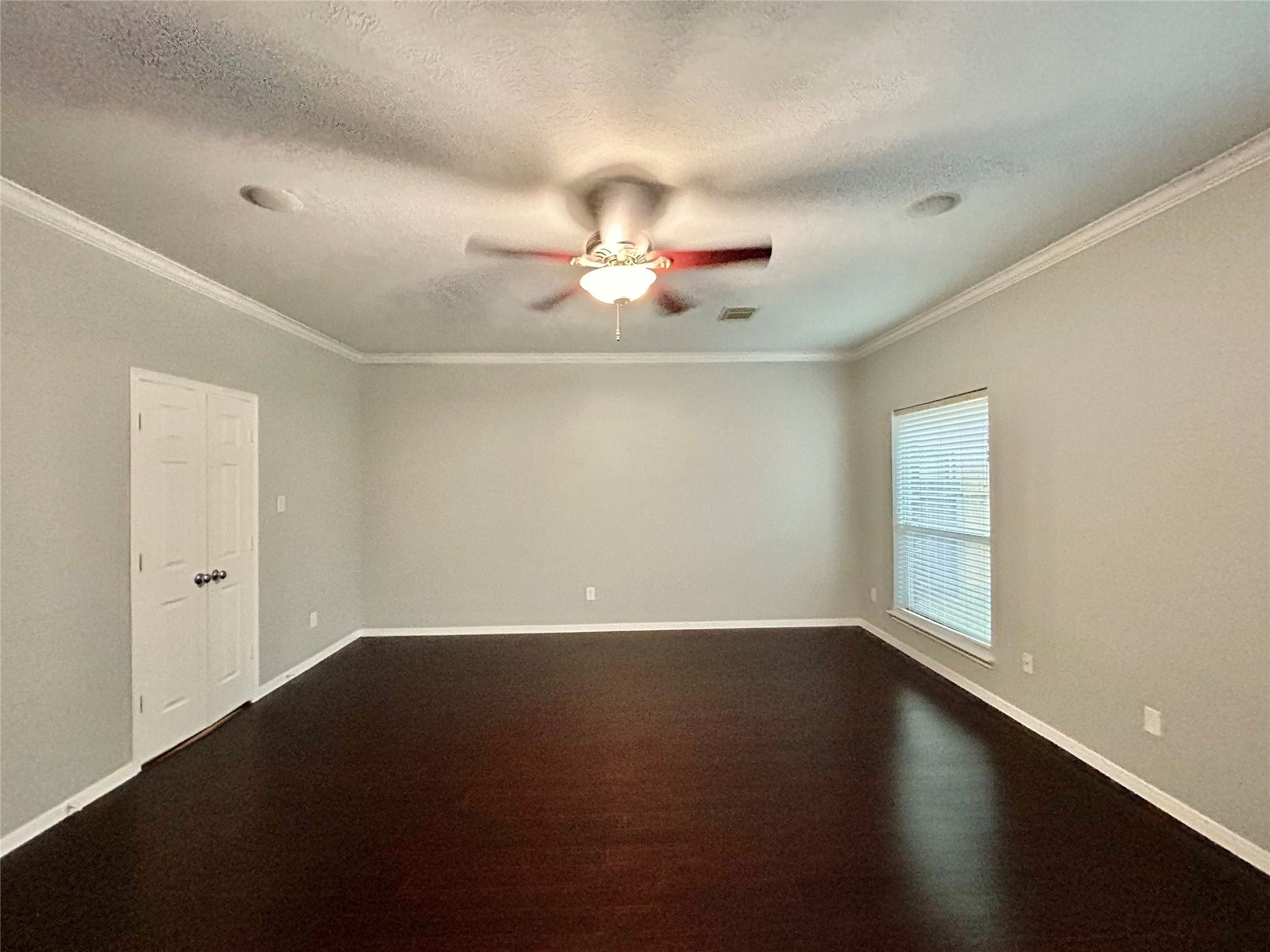 22918 Breton Point Drive Spring, TX 77373 - Photo 23 of 49 an empty room with a window and a ceiling fan