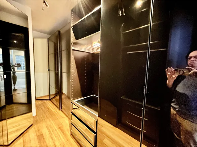 a bathroom with a sink and glass door