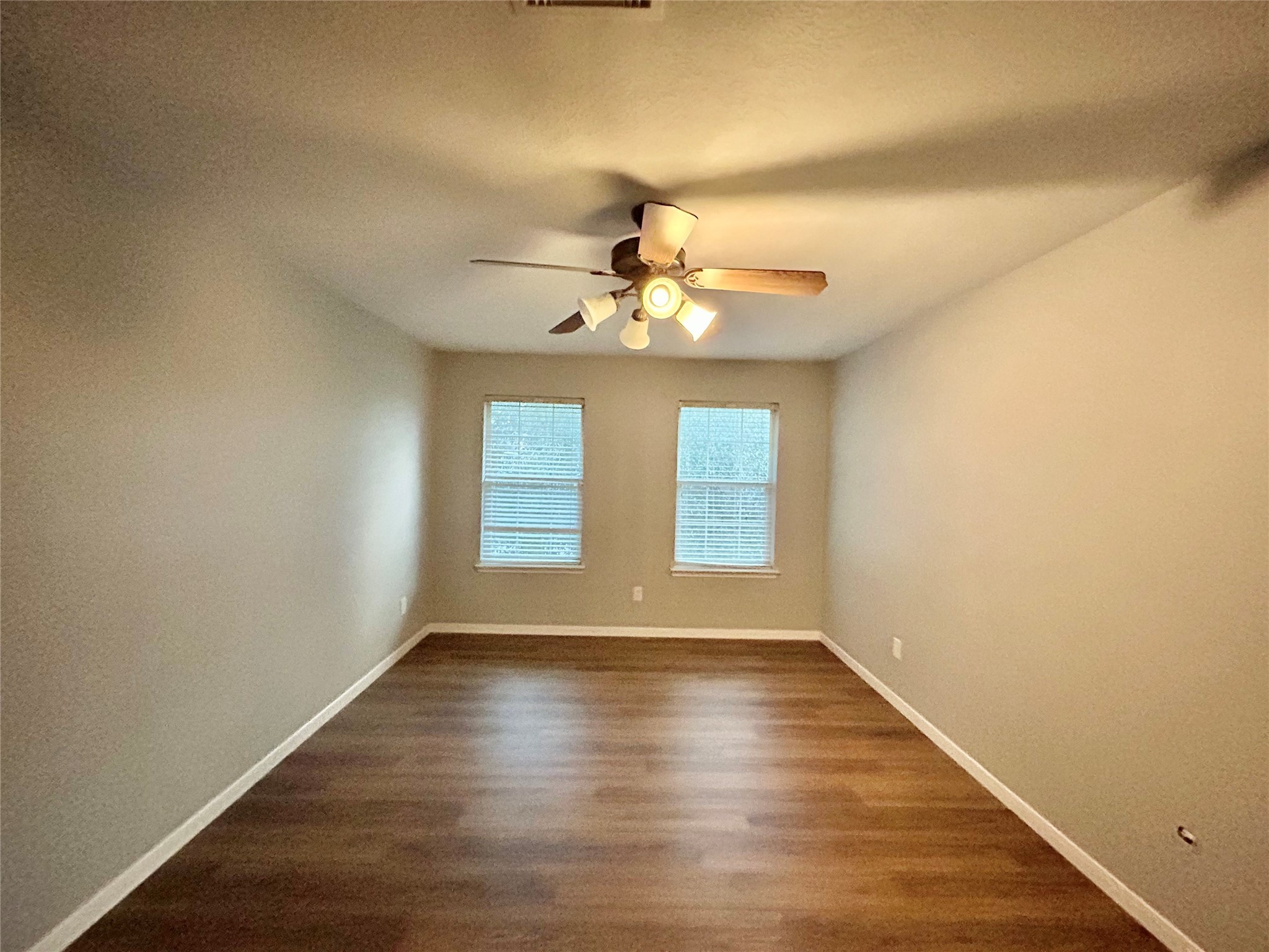 22918 Breton Point Drive Spring, TX 77373 - Photo 40 of 49 wooden floor in an empty room with a window