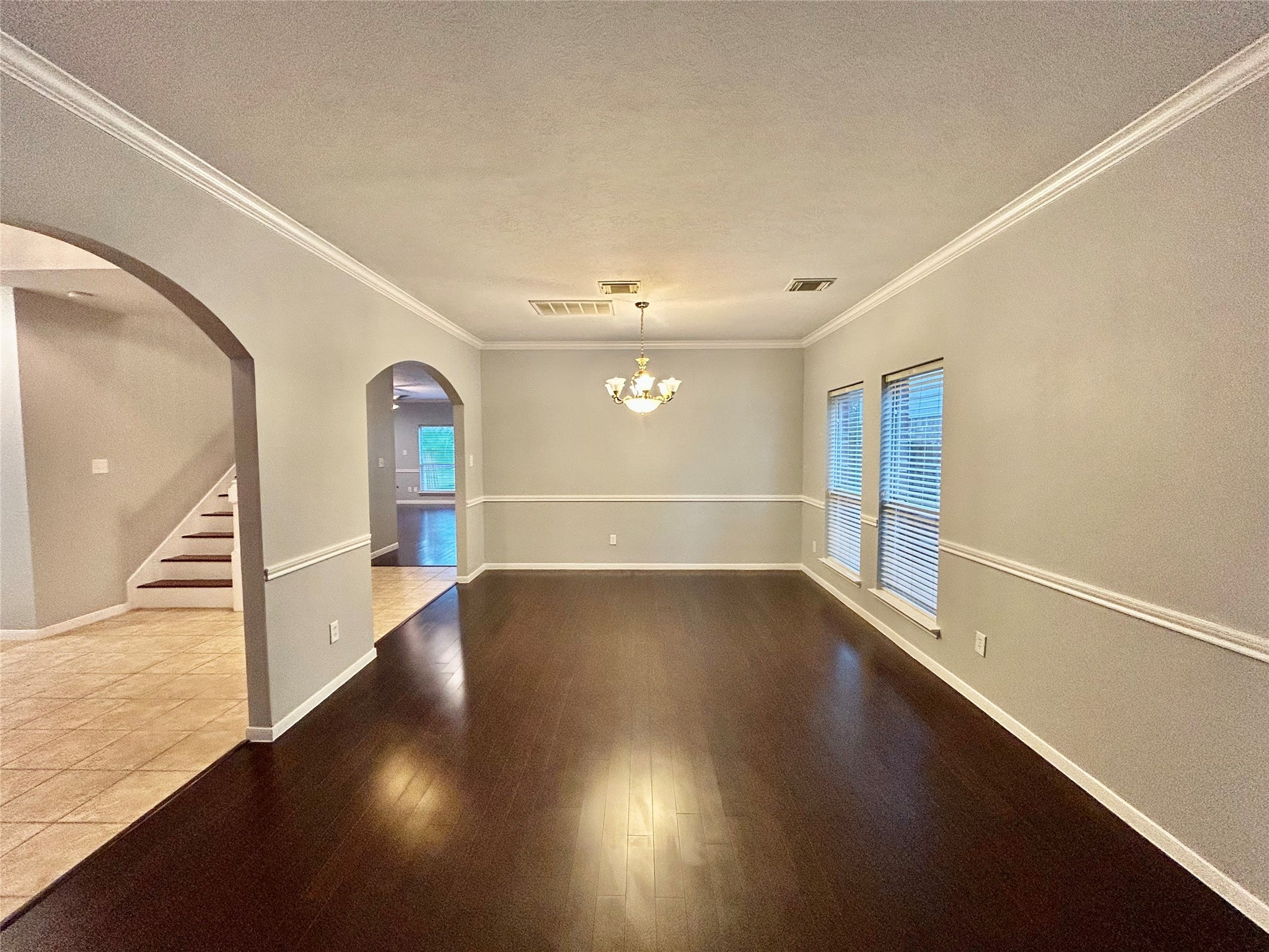 22918 Breton Point Drive Spring, TX 77373 - Photo 6 of 49 an empty room with wooden floor and windows