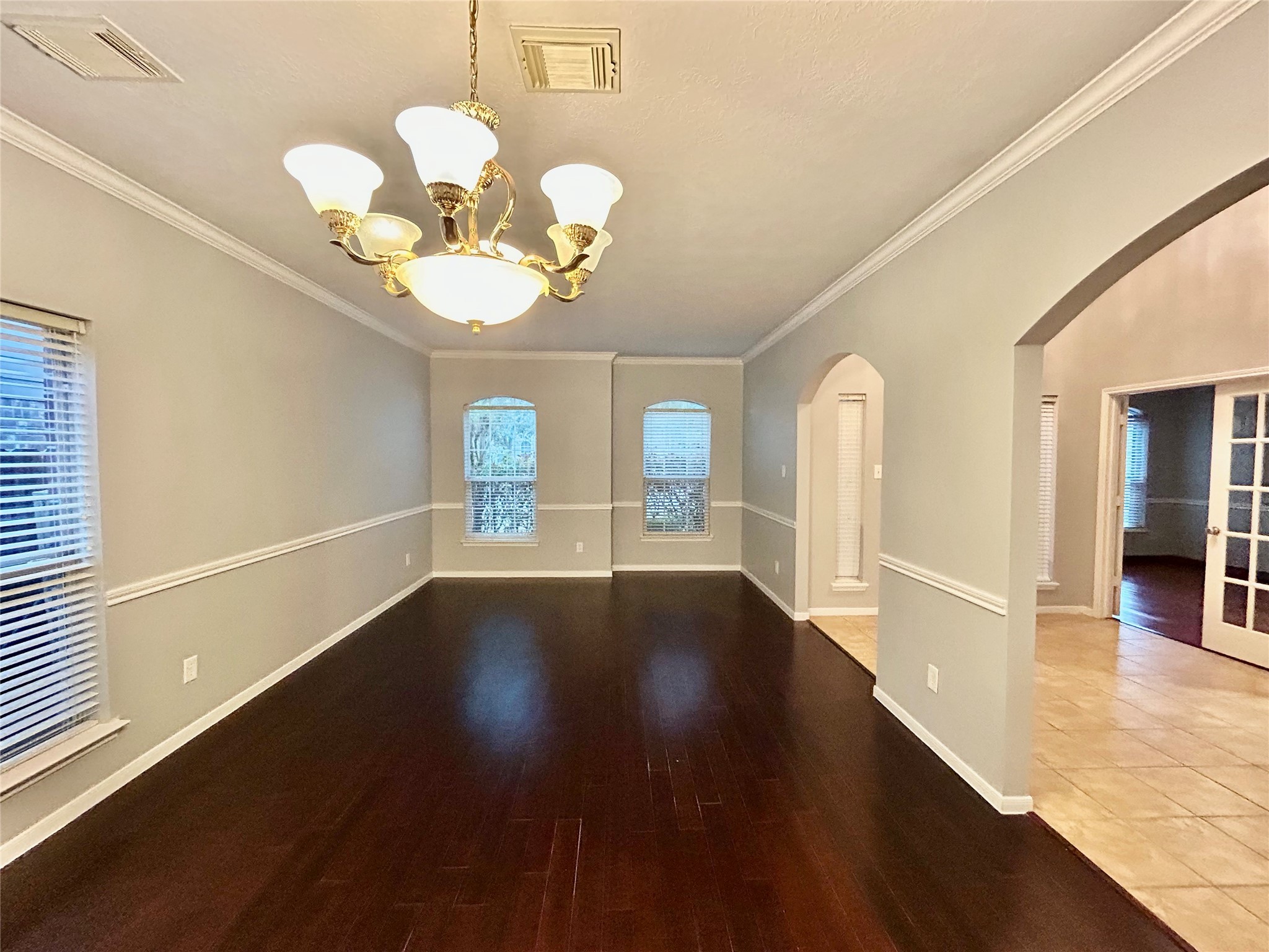 22918 Breton Point Drive Spring, TX 77373 - Photo 7 of 49 a view of an empty room with wooden floor and a window