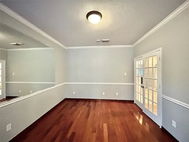 a view of room with window wooden floor and fan