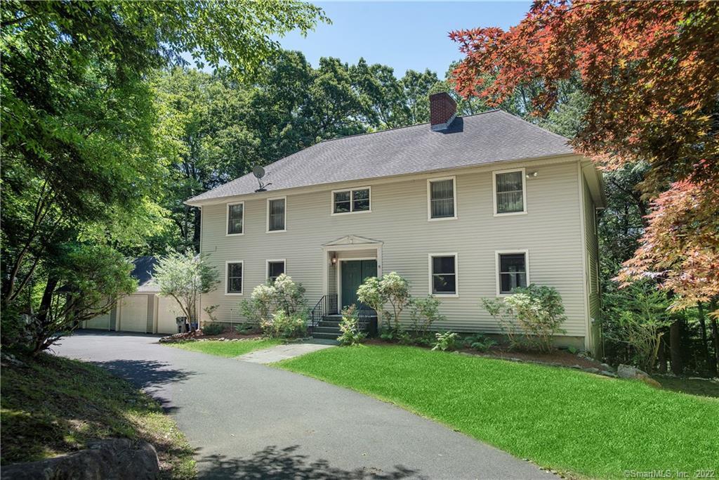 6 Old Oscaleta Road Ridgefield, CT 06877 - Photo 1 of 1 a front view of house with yard and green space