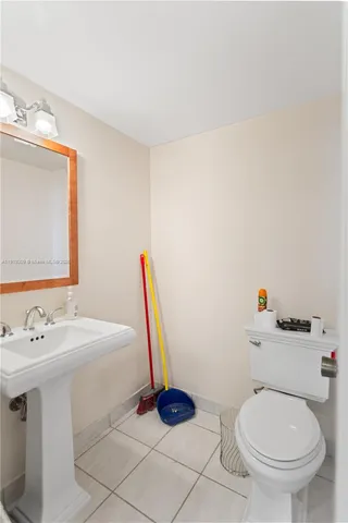 a living room with furniture a window and a chandelier