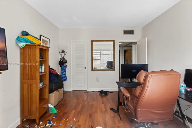 a bedroom with bed and tv