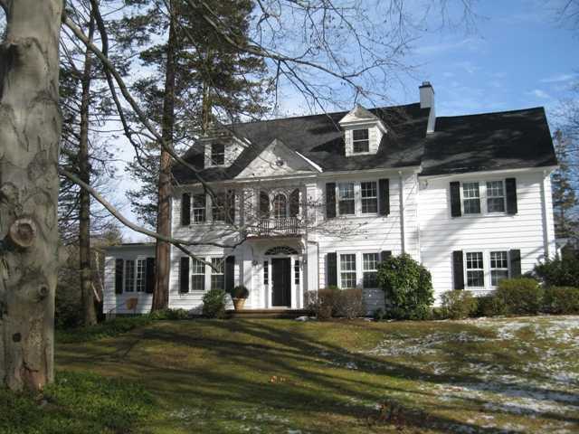 3 Intervale Place Greenwich, CT 06830 - Photo 1 of 13 a front view of a house with a garden