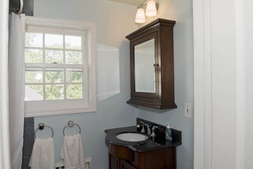 3 Intervale Place Greenwich, CT 06830 - Photo 11 of 13 a bathroom with a sink a mirror and a window