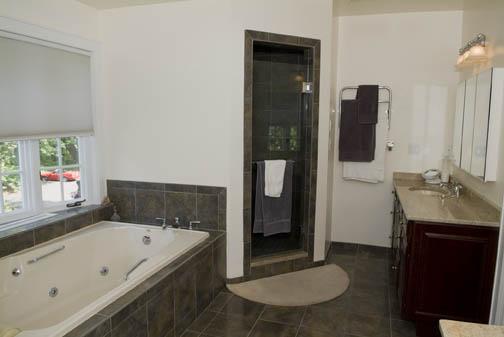 3 Intervale Place Greenwich, CT 06830 - Photo 10 of 13 a bathroom with a tub a sink and a mirror