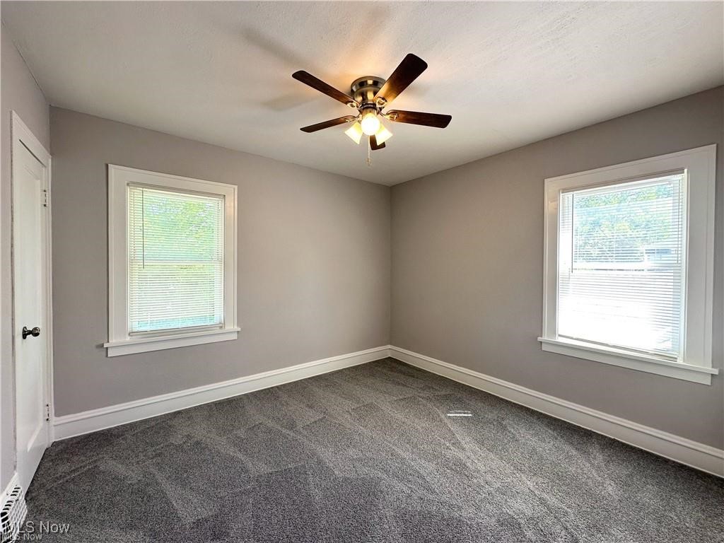 3277 Cedarbrook Road Cleveland, OH 44118 - Photo 11 of 18 Carpeted spare room with plenty of natural light and a ceiling fan