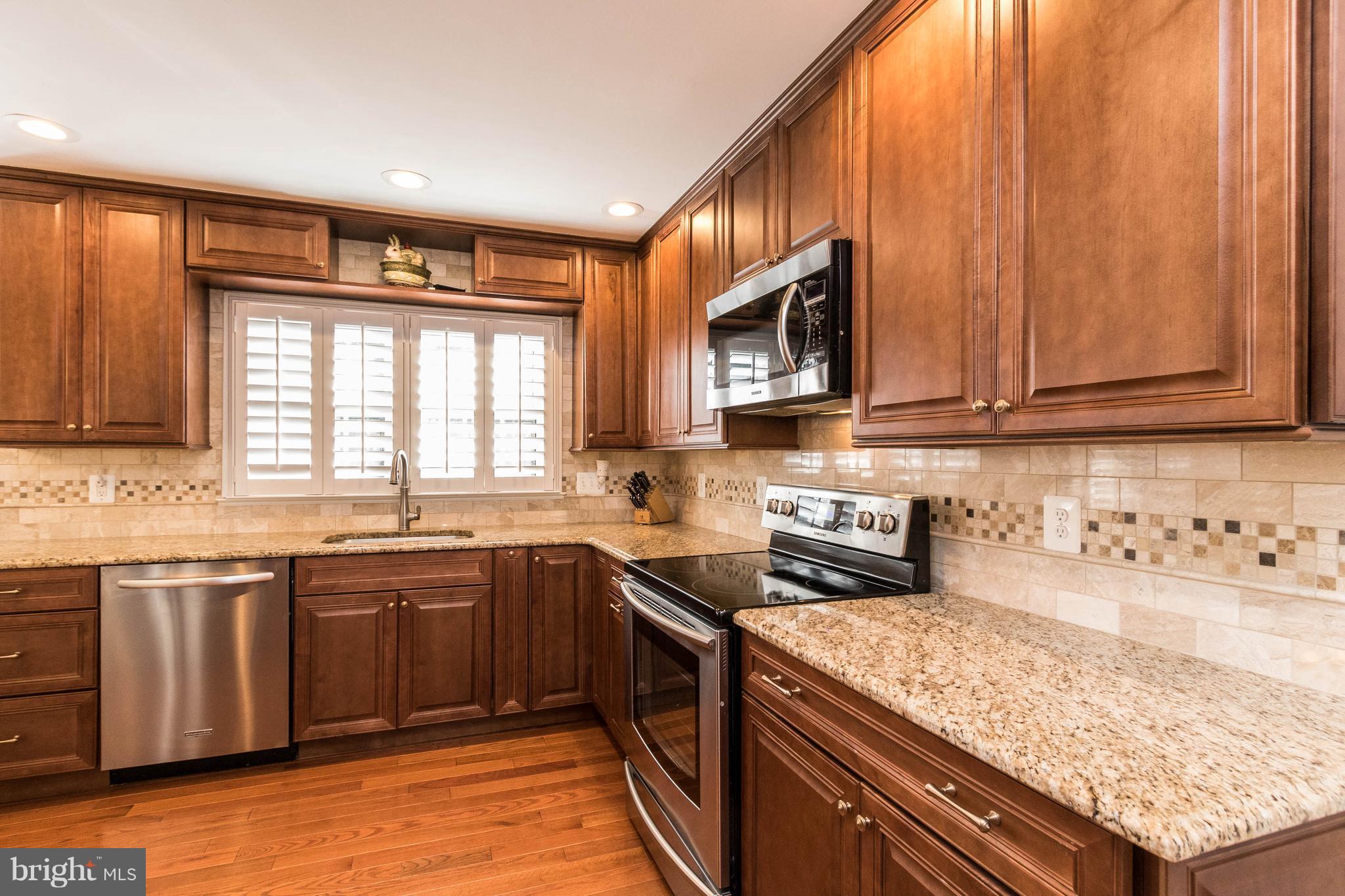 10104 Marshall Pond Road Burke, VA 22015 - Photo 12 of 30 Stainless steel appliances, wood floors