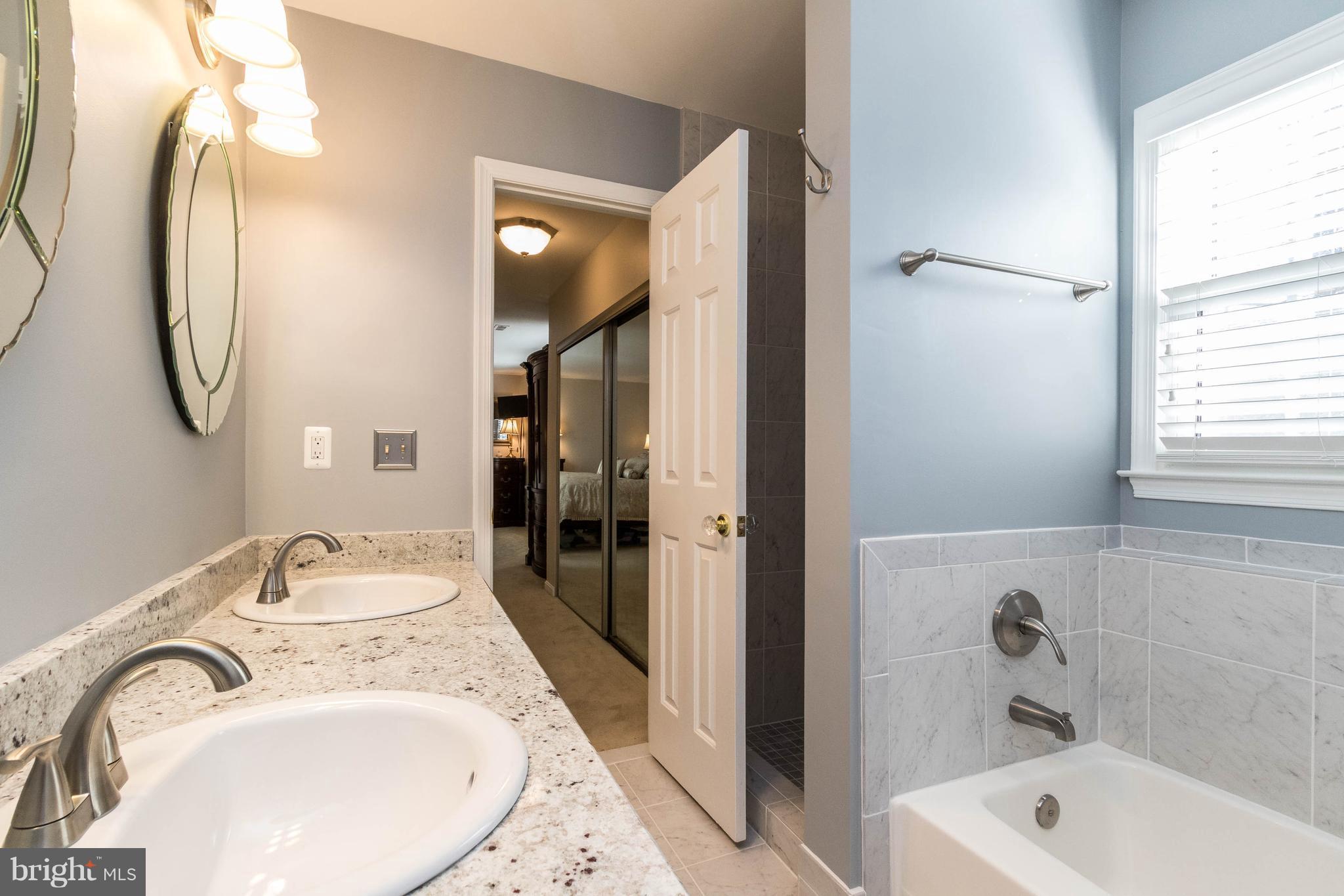 10104 Marshall Pond Road Burke, VA 22015 - Photo 19 of 30 double sinks, tiled shower and seperate stub