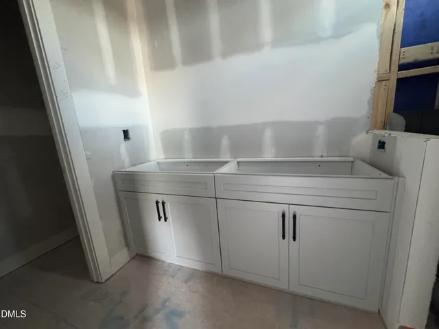 a bathroom with a tub and a window