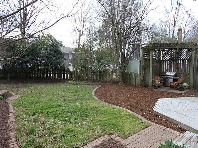 1406 Mordecai Drive Raleigh, NC 27604 - Photo 14 of 15 Wonderful Fenced Back Yard with Cooking Area Under the Pergola. Just the Right Size to Enjoy and Not Overwork You!